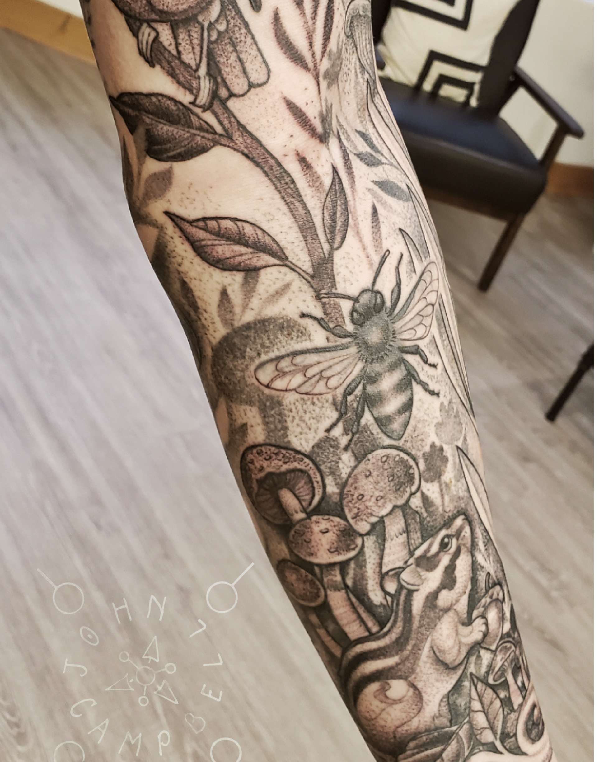 Black and Grey fine line wildlife with birds, bees and mushrooms sleeve tattoo by John Campbell at Sacred Mandala Studio tattoo parlor in Durham, NC.